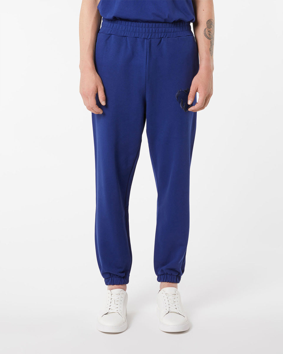 BLUE PANTS WITH EMBROIDERED FLAMING HEART