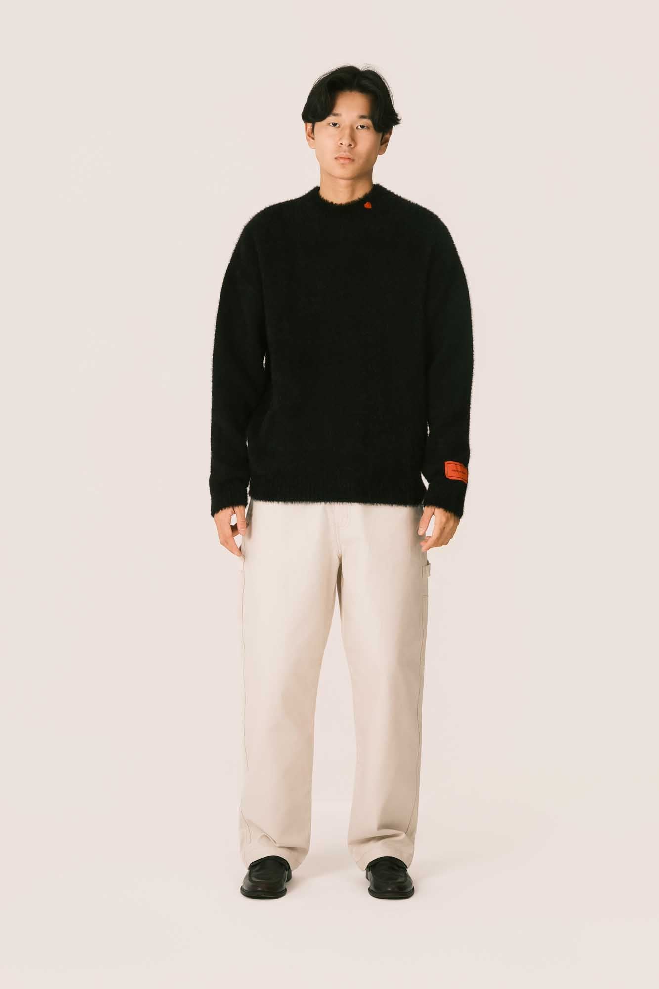 BLACK SWEATER WITH EMBROIDERED ON NECK ANCHE PATCH