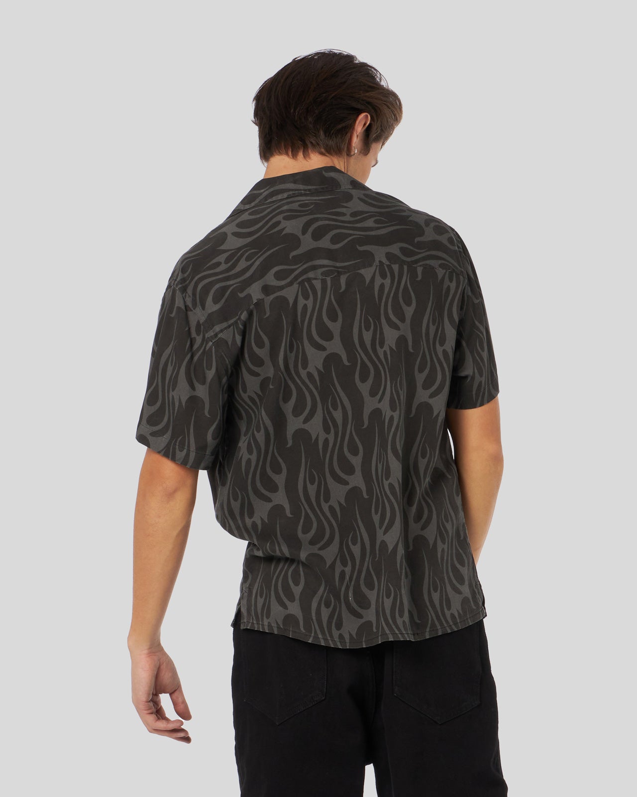 BLACK SHIRT WITH ALL OVER FLAMES PRINT AND METAL LABEL