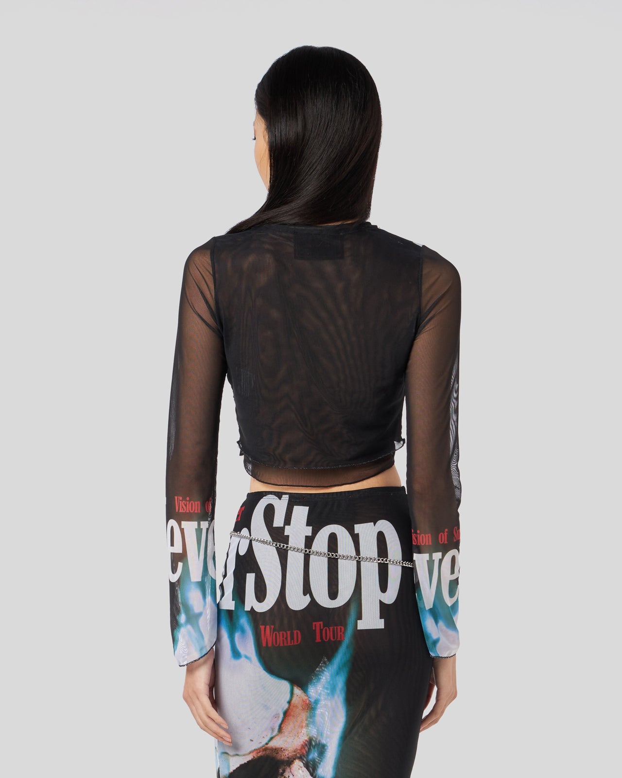 BLACK LONGSLEEVE TOP WITH NEVER STOP PRINT