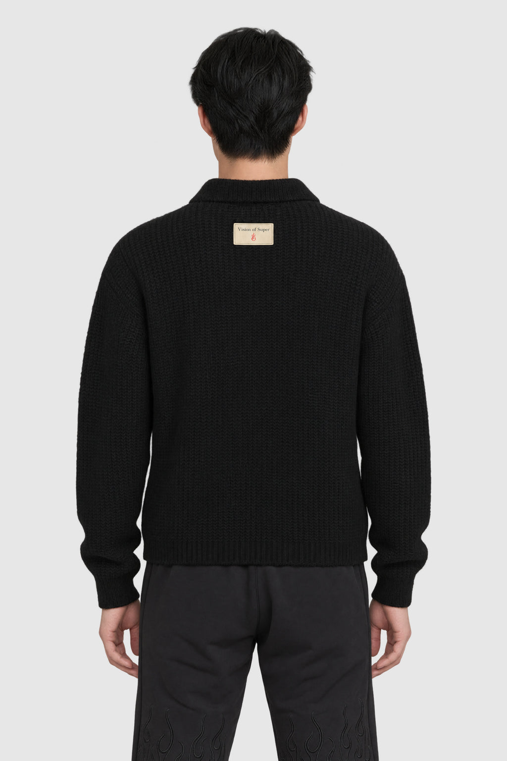 Polo in maglia grossa con alpaca – Nero – su modello, retro