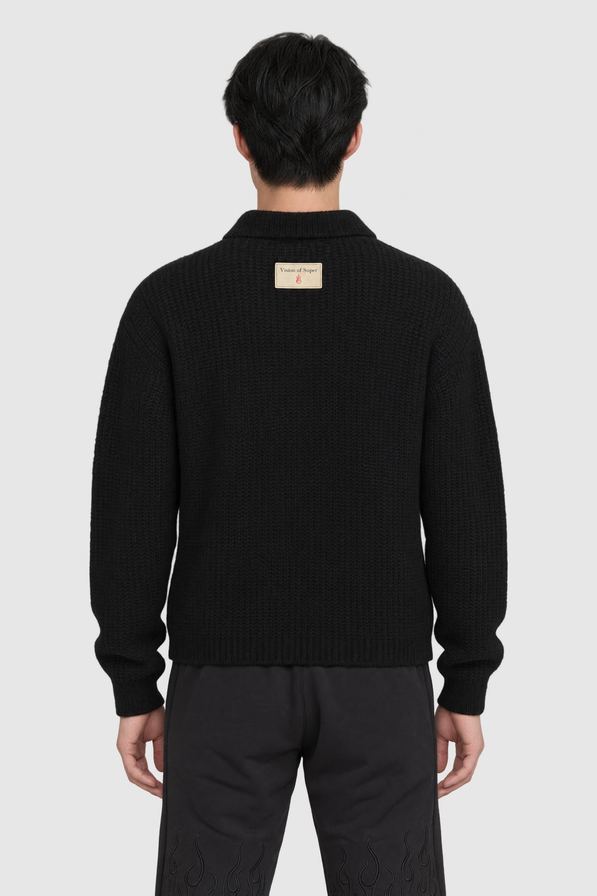 Polo in maglia grossa con alpaca – Nero – su modello, retro